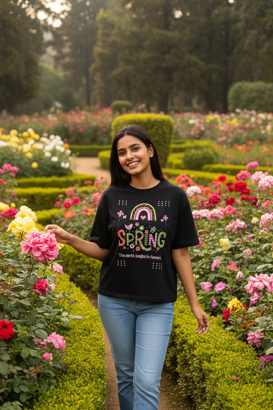 Model wearing spring earth flowers floral black classic t-shirt in flower garden