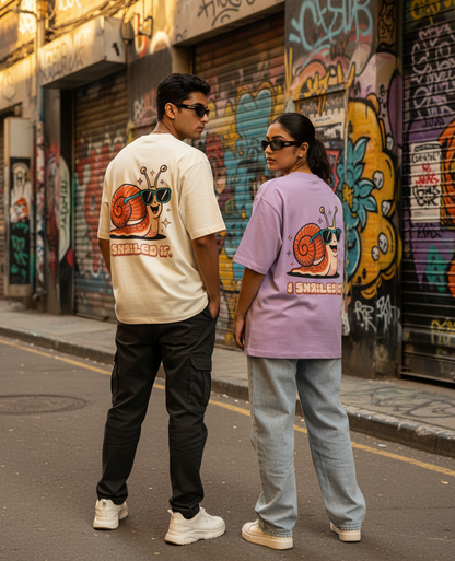 Two models wearing humour graphic oversized t-shirts saying I snailed it