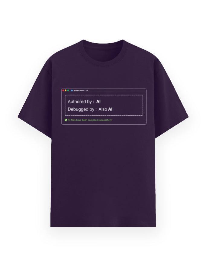 Purple classic t-shirt with a dev joke stating code was authored by AI, debugged by also AI