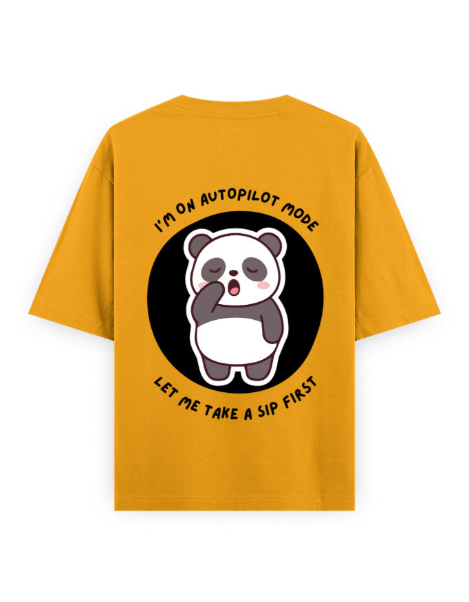 Gold oversized t-shirt with panda graphic with a quote - I’m on autopilot mode, let me take a sip first