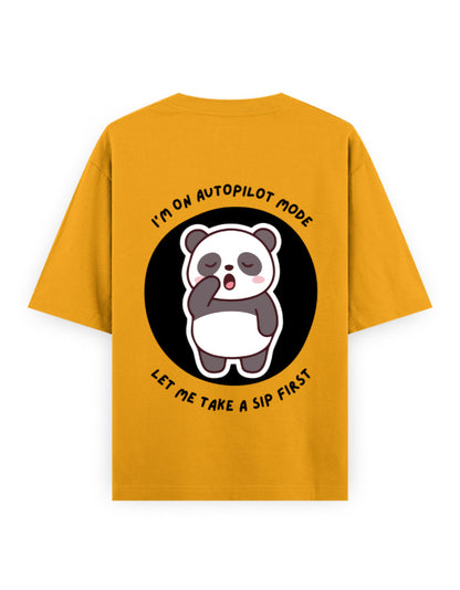 Gold oversized t-shirt with panda graphic with a quote - I’m on autopilot mode, let me take a sip first