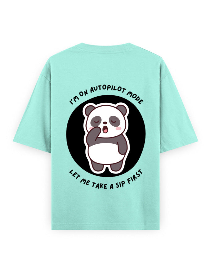 Mint color oversized t-shirt with panda graphic with a quote - I’m on autopilot mode, let me take a sip first