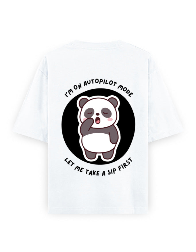 White oversized t-shirt with panda graphic with a quote - I’m on autopilot mode, let me take a sip first