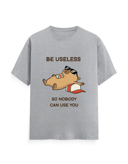 A heather gray short-sleeve t-shirt with a cartoon graphic of a brown hamster wearing sunglasses and a red-and-white cap, with the text 'BE USELESS SO NOBODY CAN USE YOU' printed on the front.