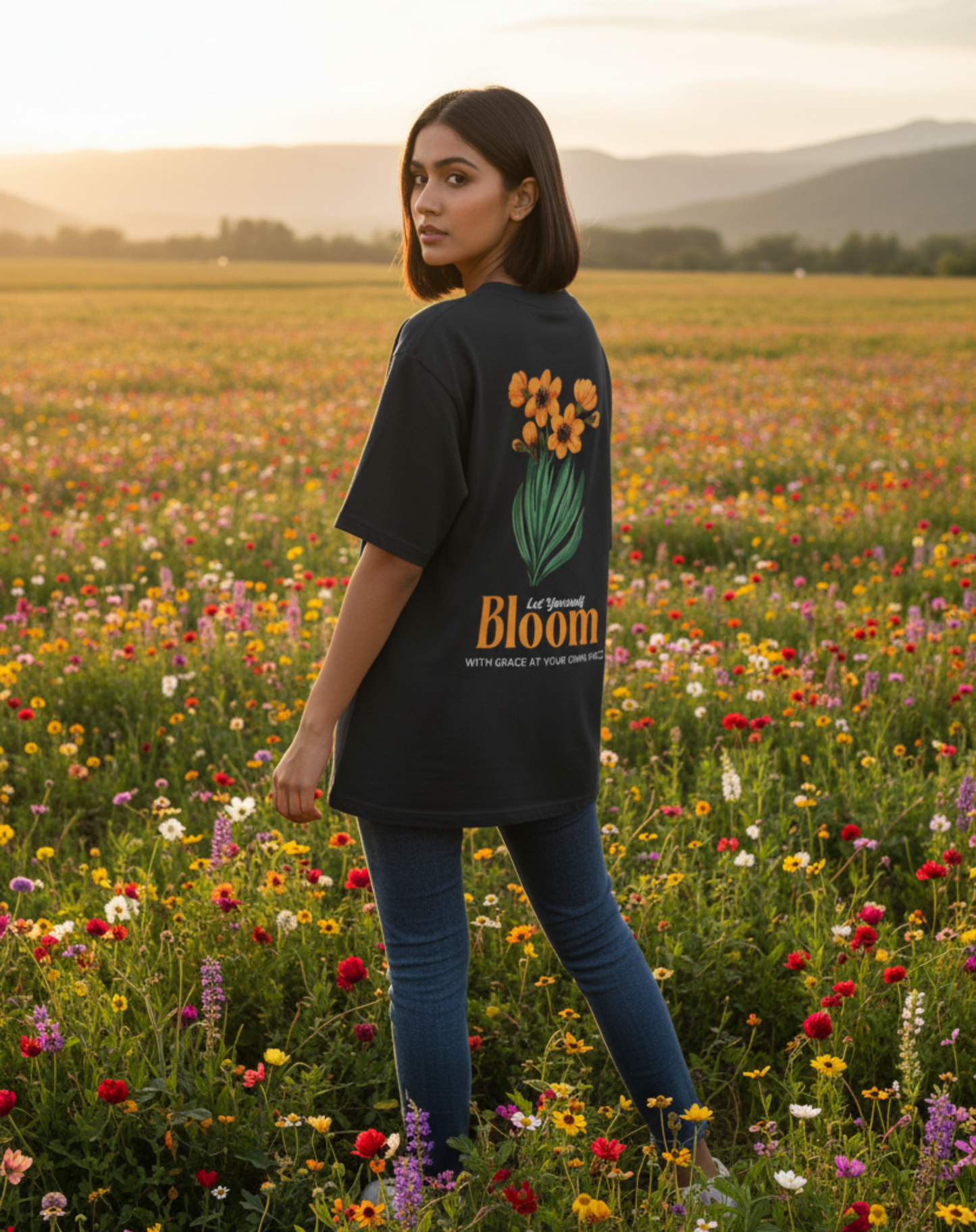 Model wearing bloom with grace floral black oversized t-shirt
