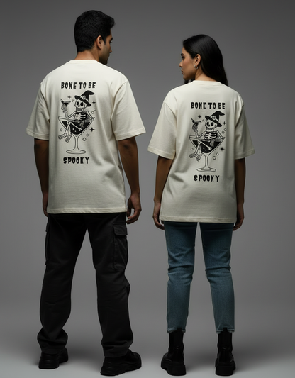 Models wearing Bone To Be Spooky graphic oversized tee in off-white color