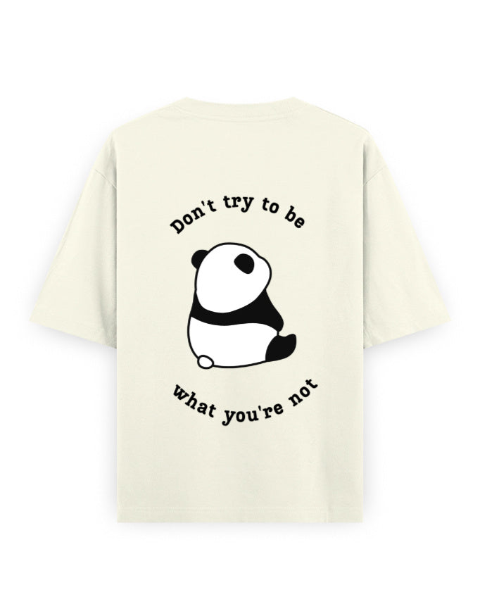 Off-white oversized t-shirt with panda graphic and quote stating Don’t try to be what you’re not