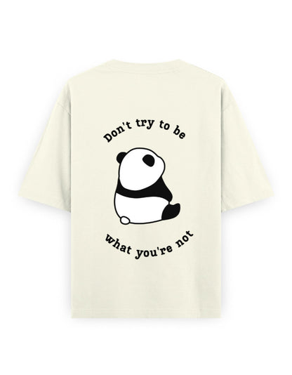 Off-white oversized t-shirt with panda graphic and quote stating Don’t try to be what you’re not