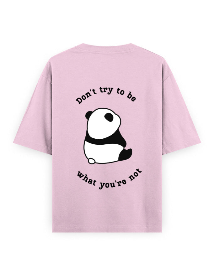 Pink oversized t-shirt with panda graphic and quote stating Don’t try to be what you’re not