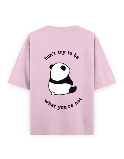 Pink oversized t-shirt with panda graphic and quote stating Don’t try to be what you’re not