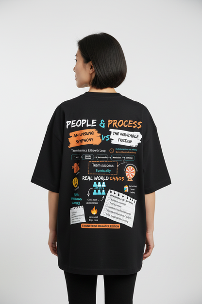 Model wearing engineering manager limited edition black oversized tee depicting the day to day lives of engineering managers