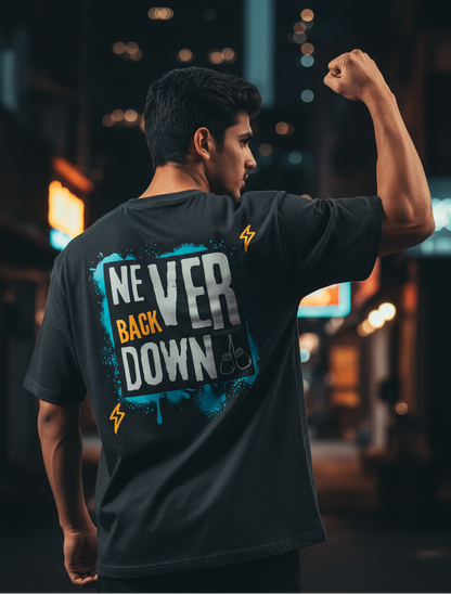 Model wearing never back down graphic black oversized t-shirt