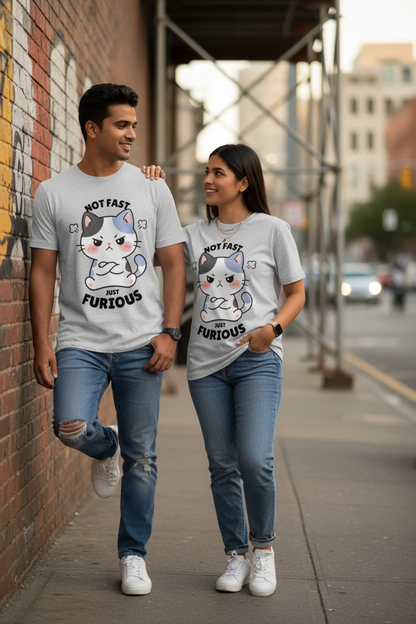 A man and a woman walking side-by-side on a city sidewalk, wearing matching light gray graphic t-shirts with a cartoon cat design and the text 'NOT FAST FURIOUS'.