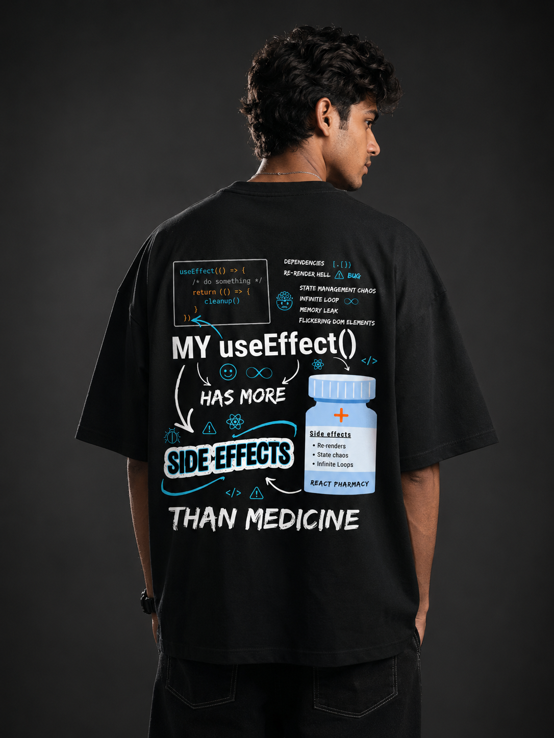 Developer wearing React limited edition black oversized tee with back print stating My useEffect() has more side effects than medicine