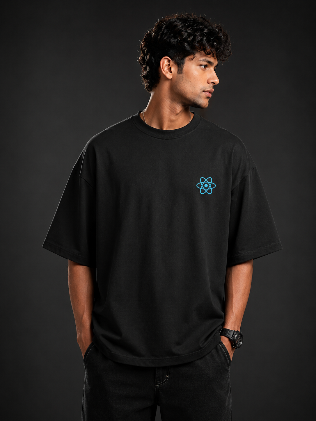 Developer wearing React limited edition oversized tee with front of the t-shirt showing React logo